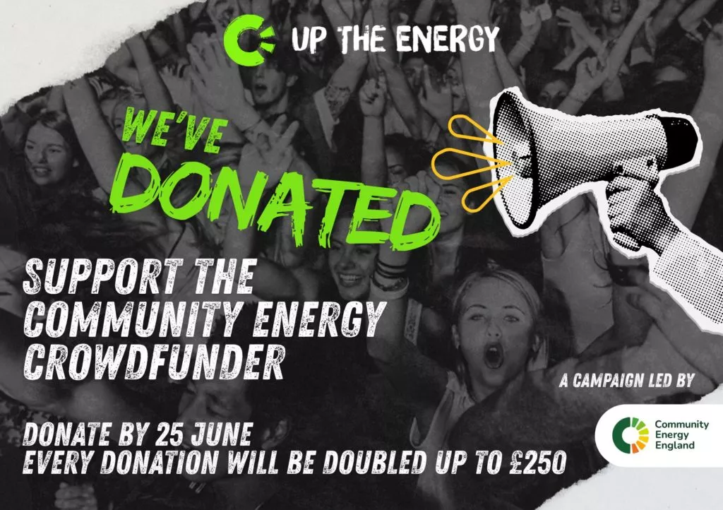 Promotional graphic for the Up The Energy campaign, featuring a black-and-white photo of a cheering crowd at a concert with a hand holding a megaphone illustration overlaid on the right. Bold green text reads 'We've Donated', with white text below stating 'Support the Community Energy Crowdfunder' and 'Donate by 25 June — every donation will be doubled up to £250'. The campaign is led by Community Energy England, whose logo appears in the bottom right.